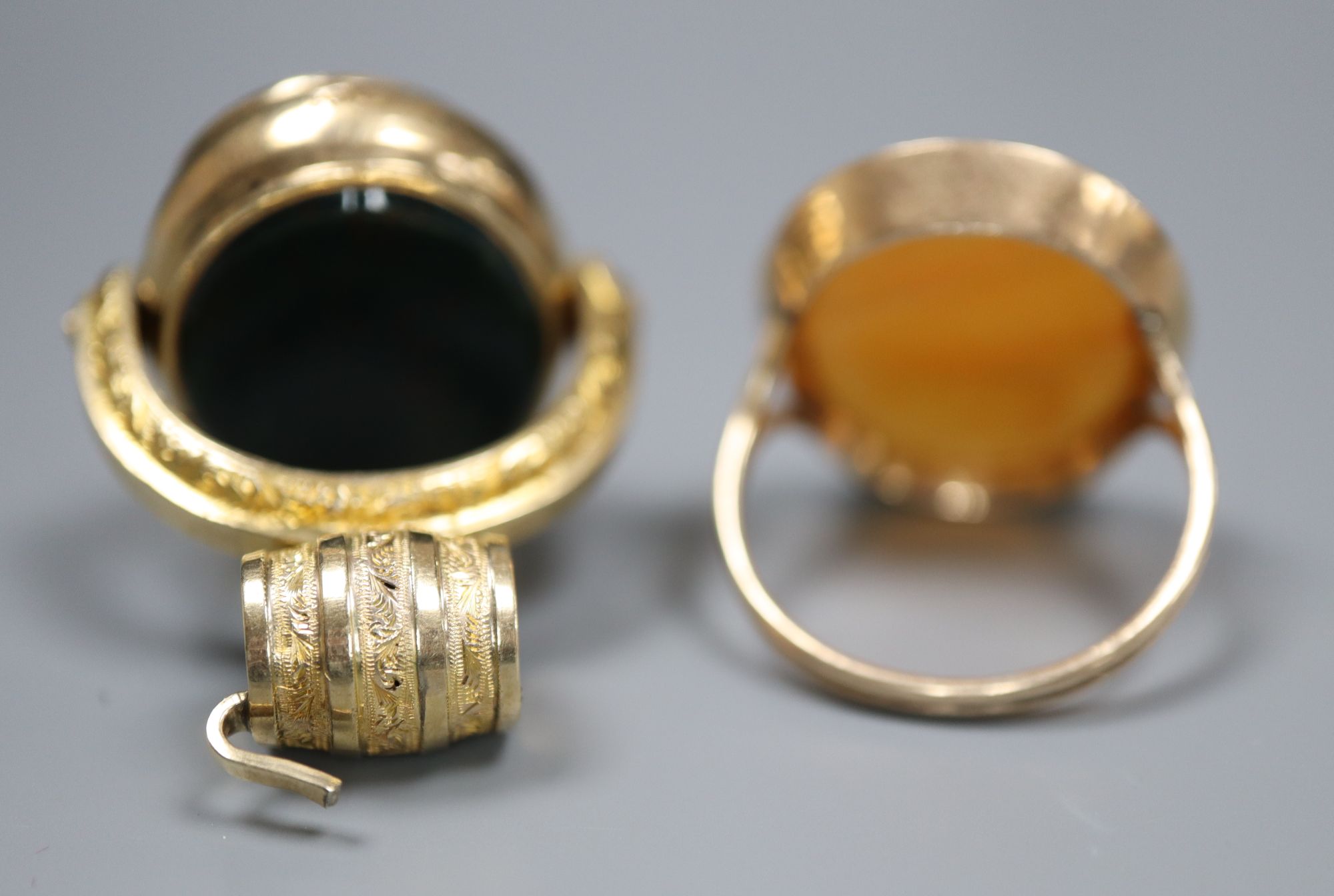 A Victorian 10ct and carnelian swivelling fob, 38mm and a similar yellow metal and carnelian ring